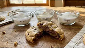 Organic monk fruit with allulose baking blend ingredients and a golden brown heart-safe cookie.